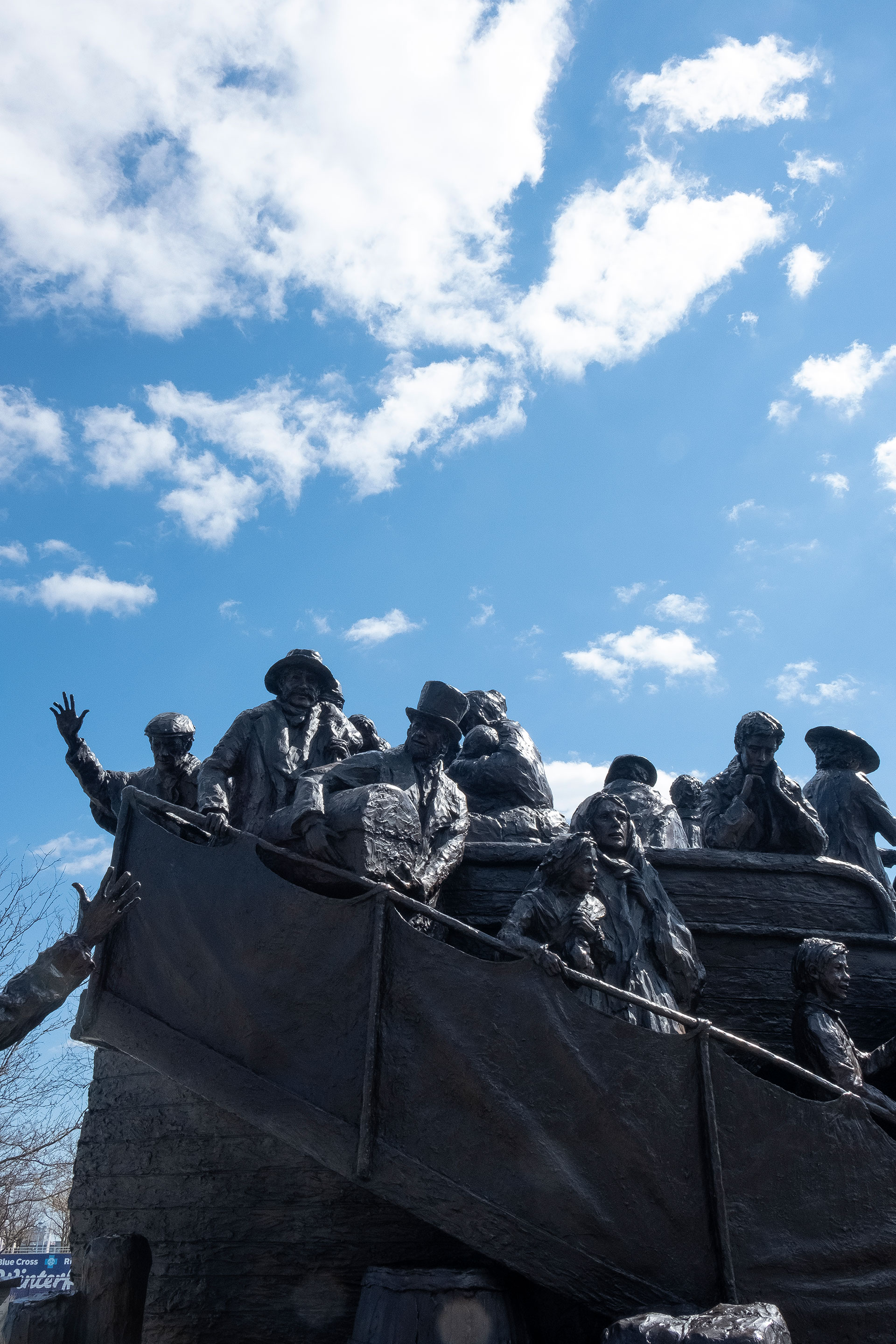 Memorial statue against a blue sky