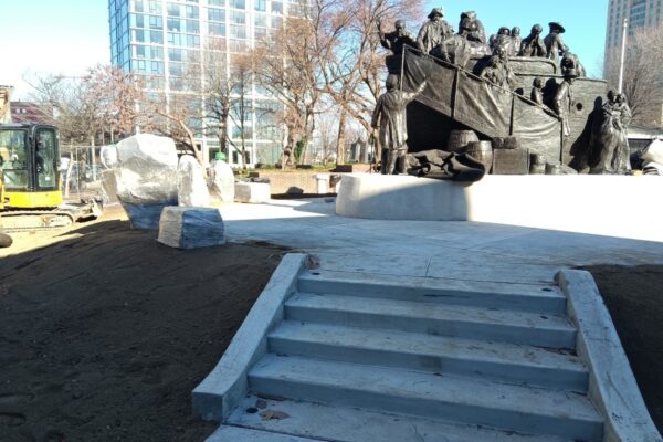 Walking up to a bronze statue of Irish immigrants arriving on a ship
