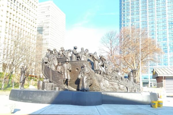 A bronze statue of Irish immigrants arriving on a ship in Old City